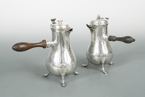 Lot 377 - An 18th century French metalwares silver chocolatière and hot water jug en suite