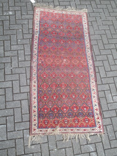 Lot 458 - A Kuba style short runner 210 x 96cm