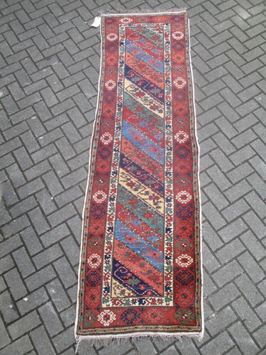 Lot 456 - A Persian runner with stripy field 268 x 79cm