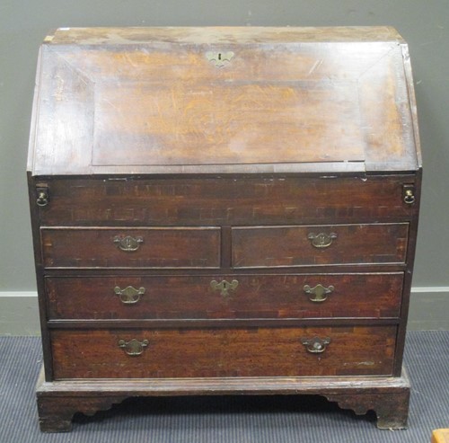 Lot 391 - An 18th century oak bureau with fitted...