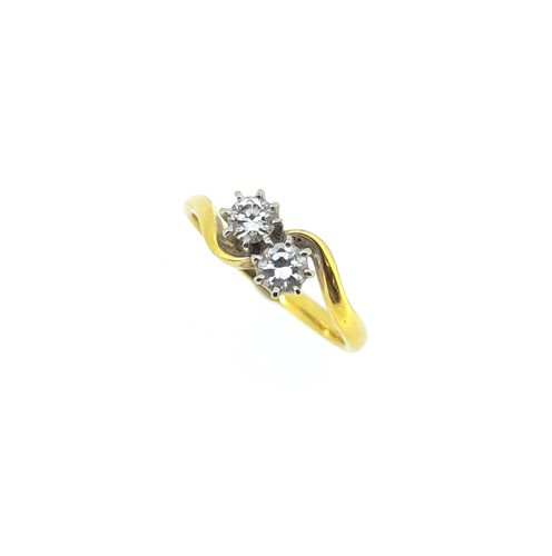 Lot 143 - An 18ct gold two stone diamond crossover ring