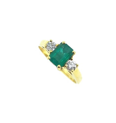 Lot 99 - An 18ct gold emerald and diamond three stone ring