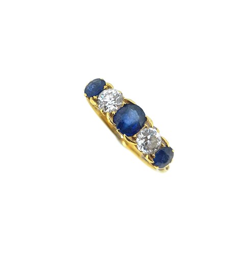 Lot 186 - A Victorian sapphire and diamond five stone carved head style ring