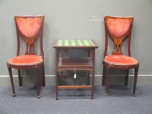 Lot 346 - A pair of Art Nouveau chairs, the shaped backs...