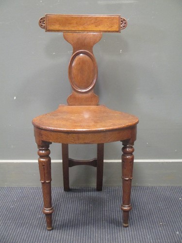 Lot 307 - An early Victorian oak hall chair