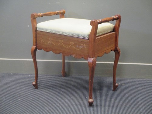 Lot 343 - A mahogany piano stool with hinged lid