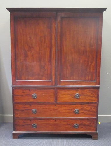 Lot 380 - A Georgian gentleman’s mahogany wardrobe with...