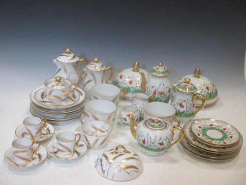 Lot 105 - A Limoges "Delvaux" part tea service decorated...