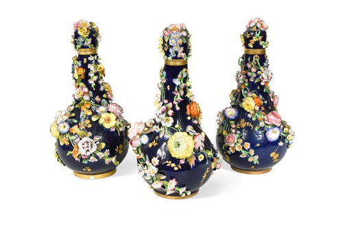 Lot 419 - A garniture of three Derby bottle vases and covers, circa 1830