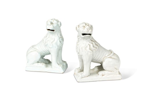 Lot 428 - A pair of 18th century Delft white glazed models of lions