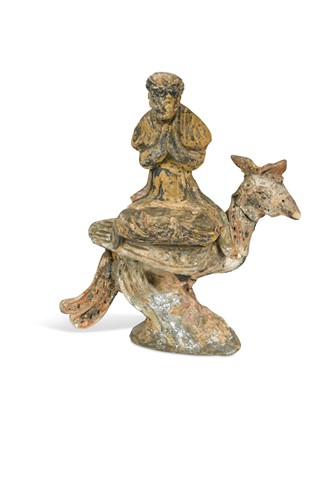 Lot 354 - A Chinese polychrome painted figure of a Buddhist deity upon a cockerel, perhaps Northern Wei Dynasty