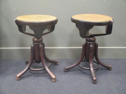 Lot 345 - A pair of Thonet adjustable piano stools with...