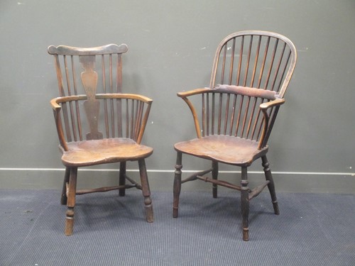 Lot 371 - A Victorian ash and elm comb back Windsor arm...