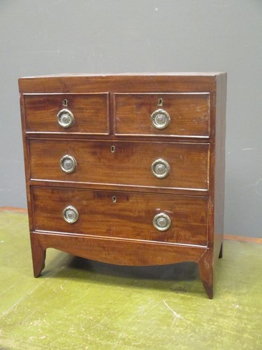 Lot 394 - A miniature George III style mahogany chest of...