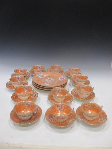 Lot 55 - An English porcelain coral pink part tea service