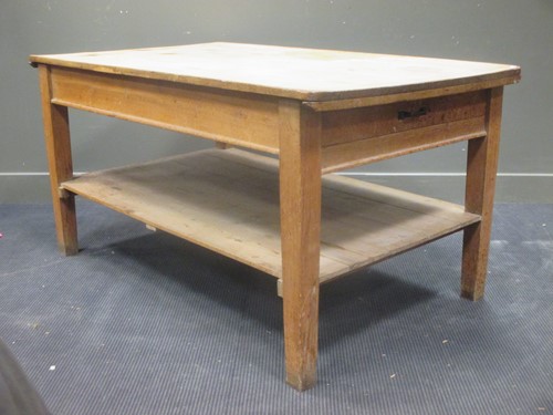 Lot 407 - An early 20th century pine kitchen table with...