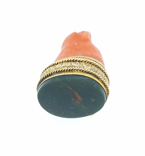 Lot 12 - A 19th century carved coral and bloodstone fob seal