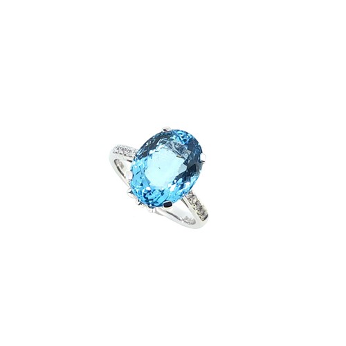 Lot 132 - An aquamarine ring with diamond set shoulders