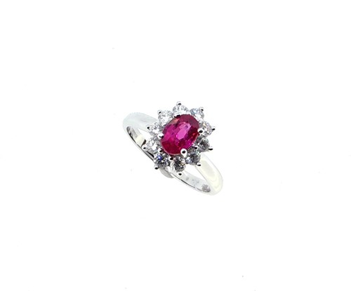 Lot 201 - An 18ct gold ruby and diamond oval cluster ring