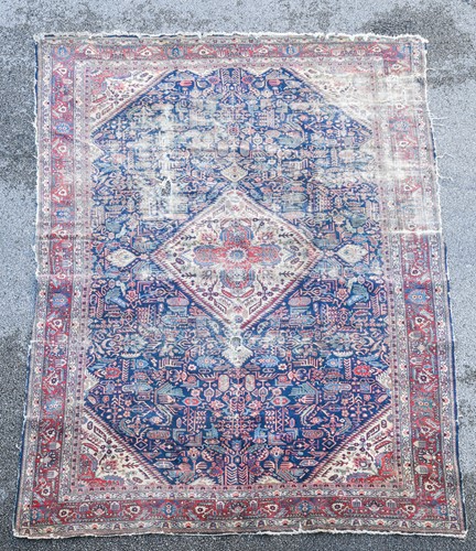 Lot 461 - An unusual early C20 Persian carpet,for restoration