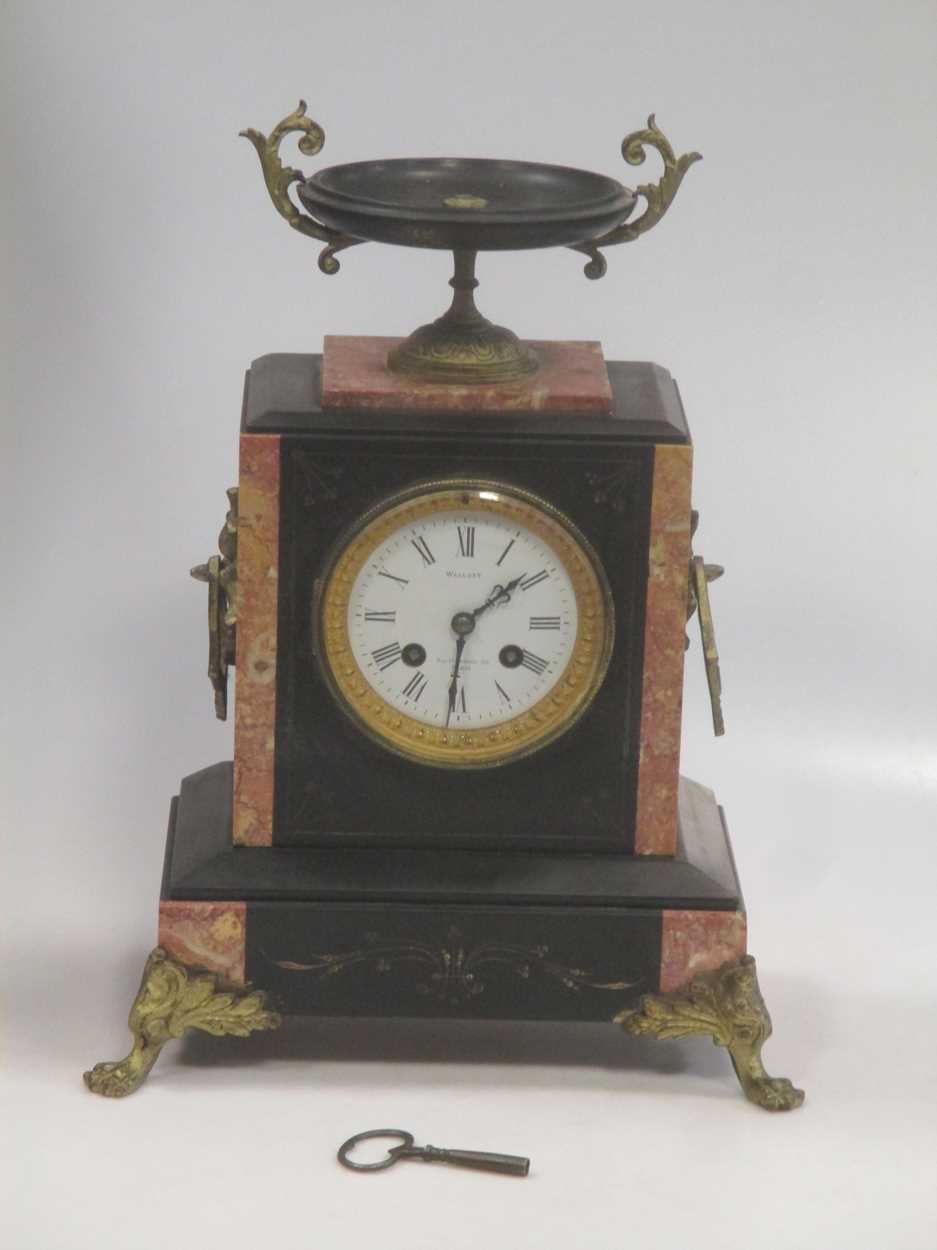 Lot 154 - A late 19th century black marble mantel clock,...