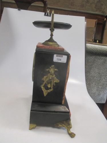 Lot 154 - A late 19th century black marble mantel clock,...