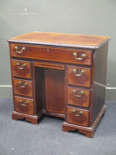 Lot 326 - A 19th century mahogany and inlaid kneehole...