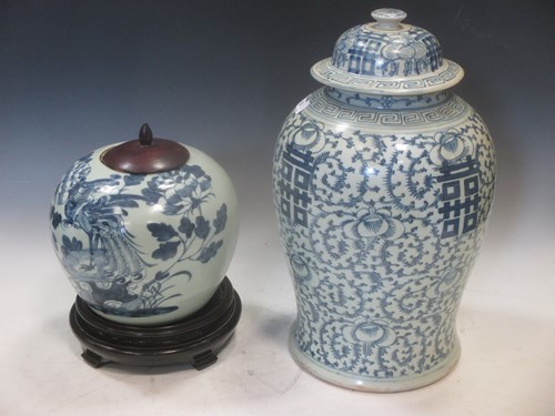 Lot 158 - A blue and white lidded vase with four...