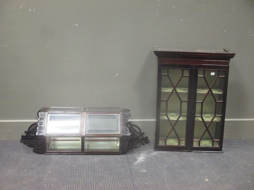Lot 409 - A 19th century glazed mahogany hanging cabinet,...