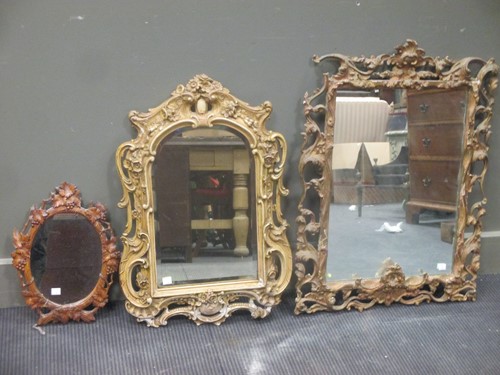 Lot 405 - Two gilt framed wall mirrors and another Black...