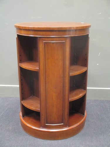 Lot 341 - A 20th century yew wood cylindrical rotating...