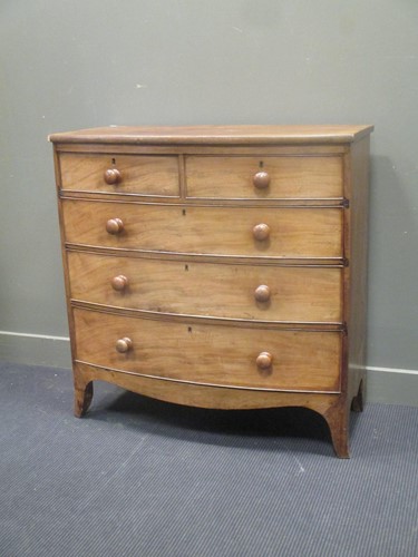 Lot 317 - A 19th century mahogany bow front chest of two...