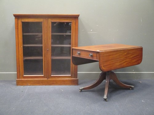Lot 336 - A walnut two door glazed bookcase with three...