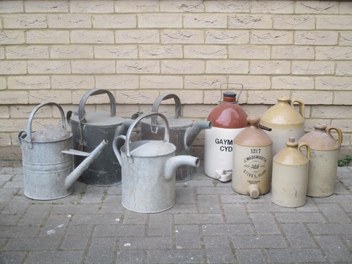 Lot 455 - Four watering cans and various stoneware items...