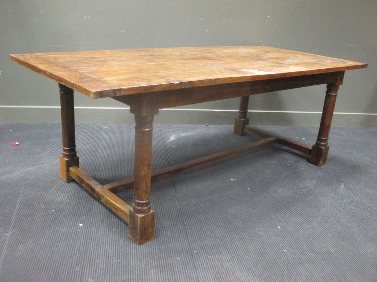 Lot 433 - A Colonial Iroko wood dining table, 76 x 213 x...