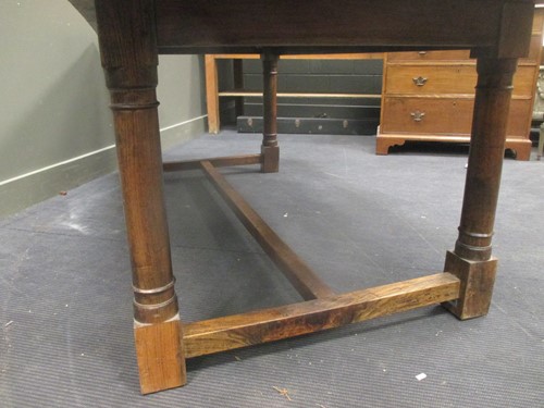 Lot 433 - A Colonial Iroko wood dining table, 76 x 213 x...