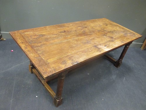Lot 433 - A Colonial Iroko wood dining table, 76 x 213 x...