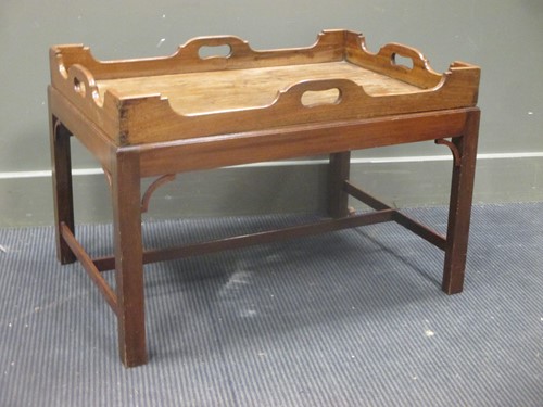 Lot 396 - A mahogany butlers tray on stand
