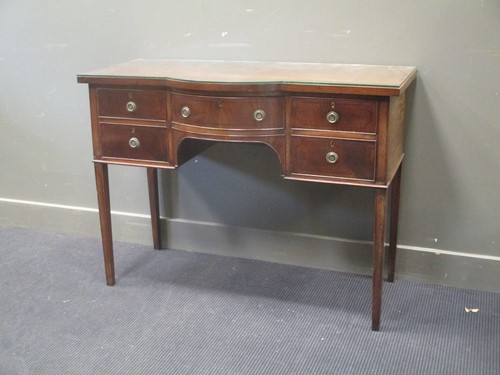 Lot 299 - An Edwardian mahognay sideboard on square...