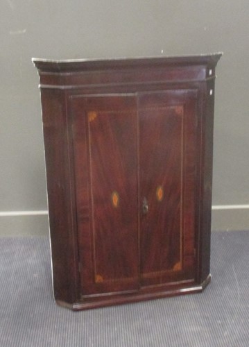 Lot 596 - A George III inlaid mahogany corner cupboard,...