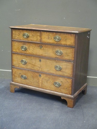 Lot 562 - An 18th century walnut and oak chest of...