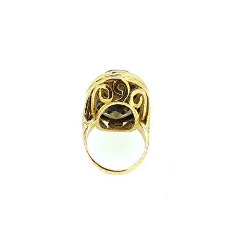 Lot 21 - A 9ct gold large smokey quartz dress ring