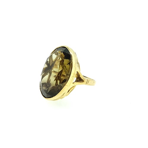 Lot 21 - A 9ct gold large smokey quartz dress ring