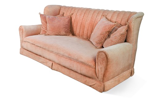 Lot 610 - A pink upholstered three seater sofa, 20th century