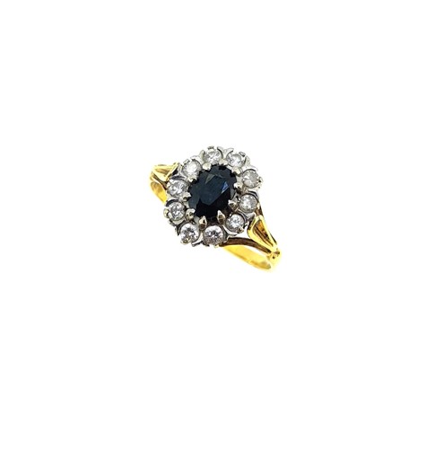 Lot 114 - A late 20th century 18ct gold sapphire and diamond cluster ring