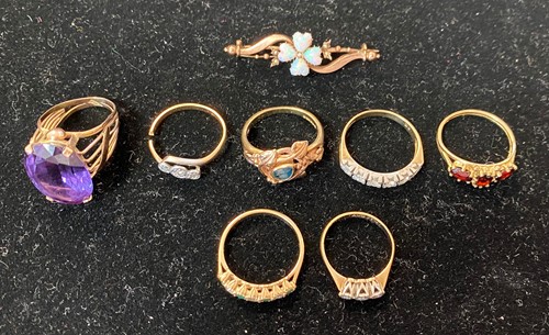 Lot 380 - A collection of gemstone rings and a brooch,...