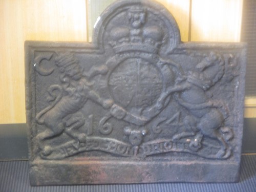 Lot 674 - A cast iron fire back, bearing the date 1664,...