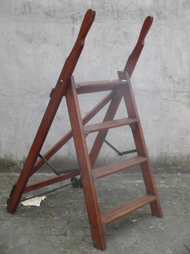 Lot 651 - A set of varnished pine library steps, partly...