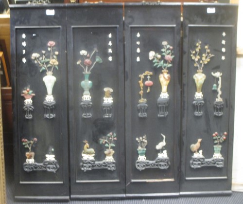 Lot 215 - Four black lacquer panels inlaid with semi...