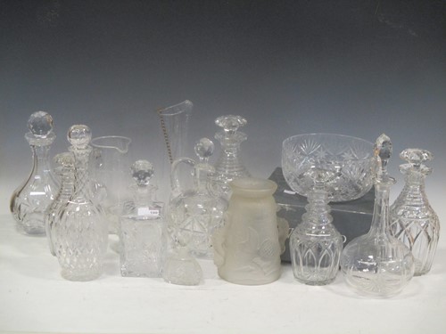 Lot 100 - A collection of cut glass decanters and jugs,...